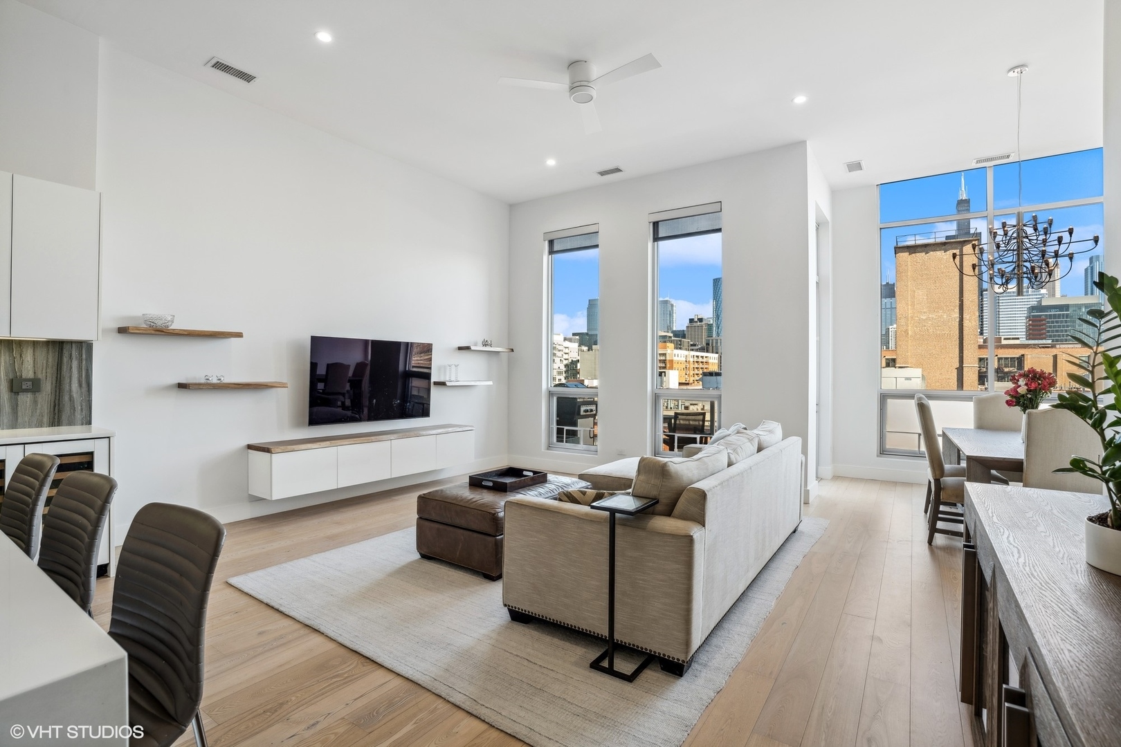 128 South Aberdeen Street, Unit PHN Chicago, IL 60607 - Photo 2 of 43 a living room with furniture and a flat screen tv