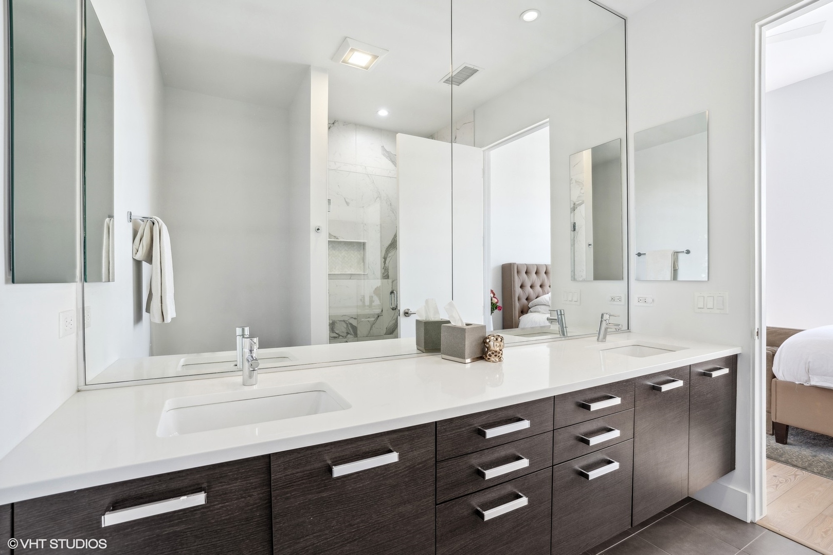 128 South Aberdeen Street, Unit PHN Chicago, IL 60607 - Photo 21 of 43 a bathroom with a double vanity sink and a mirror