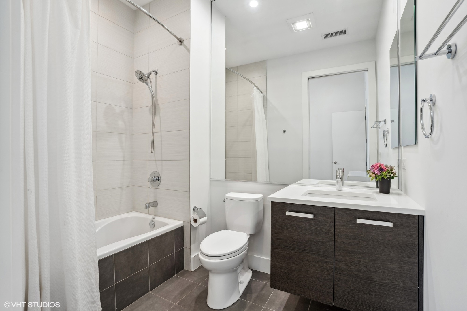128 South Aberdeen Street, Unit PHN Chicago, IL 60607 - Photo 26 of 43 a bathroom with a sink a toilet and shower