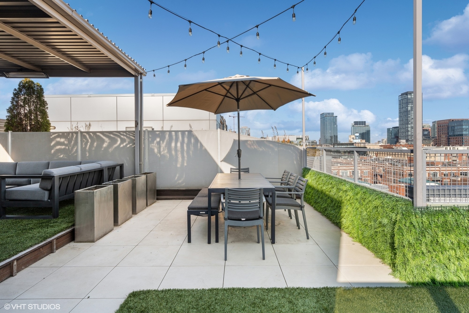 128 South Aberdeen Street, Unit PHN Chicago, IL 60607 - Photo 40 of 43 a balcony with table and chairs