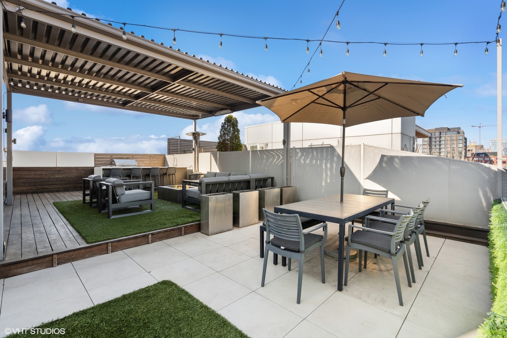 128 South Aberdeen Street, Unit PHN Chicago, IL 60607 - Photo 41 of 43 a patio with a table and chairs