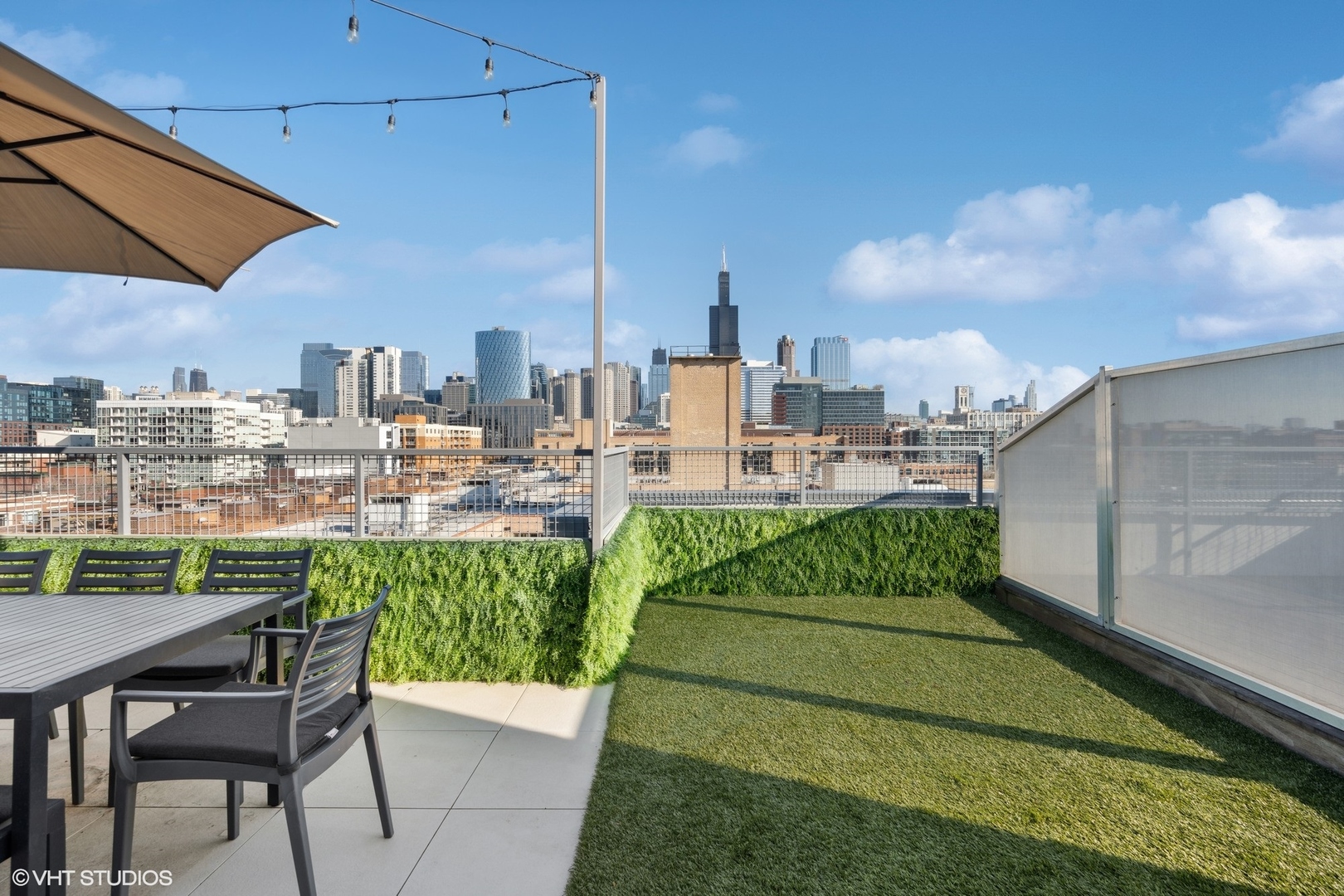 128 South Aberdeen Street, Unit PHN Chicago, IL 60607 - Photo 43 of 43 a terrace with outdoor seating and city view