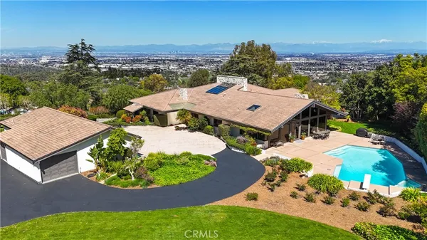 an aerial view of a house with a garden