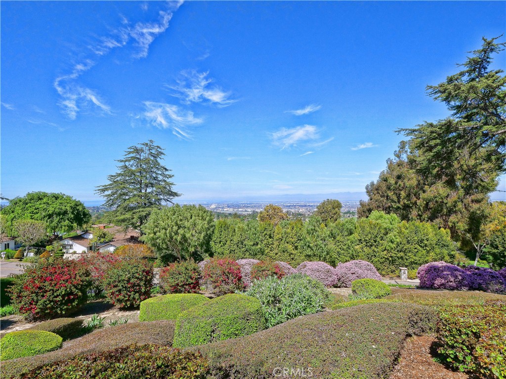 57 Saddleback Road Rolling Hills, CA 90274 - Photo 11 of 38 a view of a table and chairs in a garden