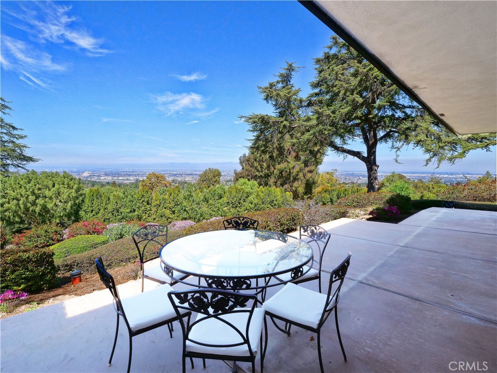 57 Saddleback Road Rolling Hills, CA 90274 - Photo 12 of 38 a view of a chairs and table in the patio