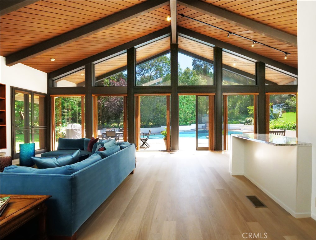 57 Saddleback Road Rolling Hills, CA 90274 - Photo 14 of 38 a living room with furniture and floor to ceiling windows