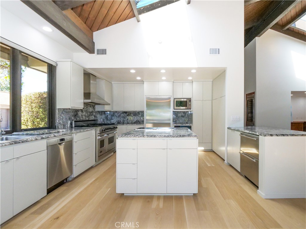 57 Saddleback Road Rolling Hills, CA 90274 - Photo 18 of 38 a kitchen with stainless steel appliances granite countertop a stove and a sink