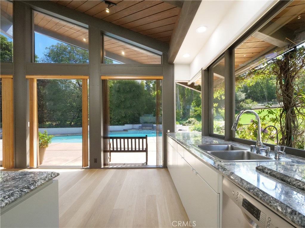 57 Saddleback Road Rolling Hills, CA 90274 - Photo 19 of 38 a view of a kitchen with granite countertop a sink and a large window