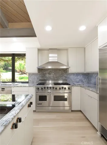 a kitchen with a stove and a sink