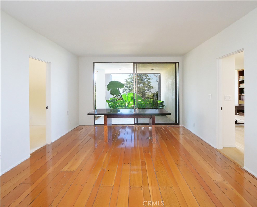 57 Saddleback Road Rolling Hills, CA 90274 - Photo 24 of 38 a view of an empty room with wooden floor and a window