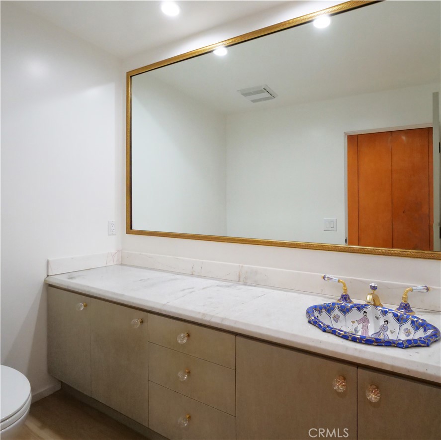 57 Saddleback Road Rolling Hills, CA 90274 - Photo 25 of 38 a bathroom with a sink and a mirror