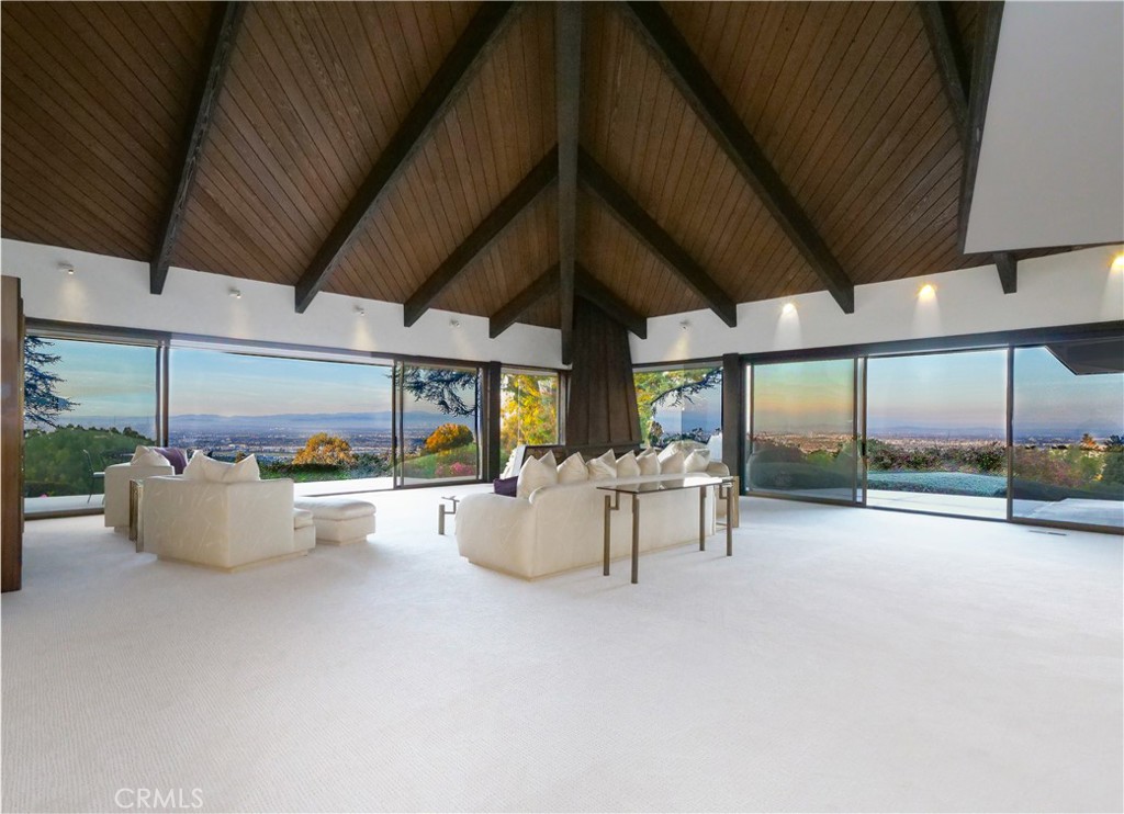 57 Saddleback Road Rolling Hills, CA 90274 - Photo 6 of 38 a view of a patio with table and chairs barbeque with wooden fence