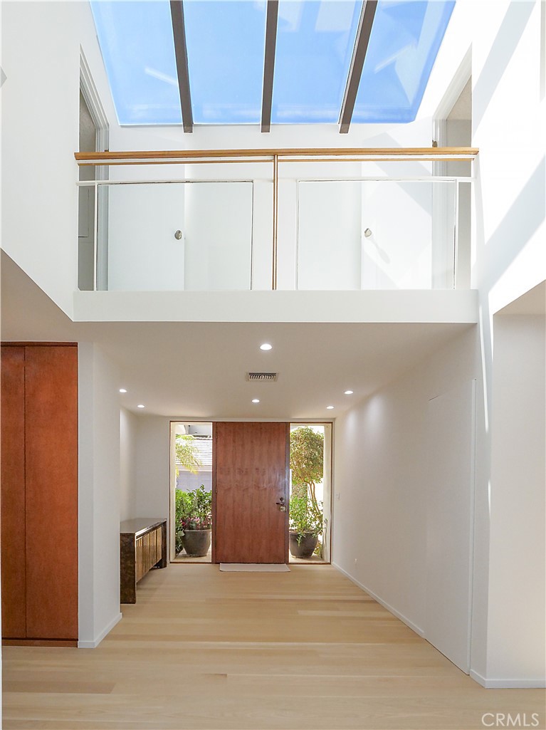 57 Saddleback Road Rolling Hills, CA 90274 - Photo 8 of 38 a view of a hallway with wooden floor and windows