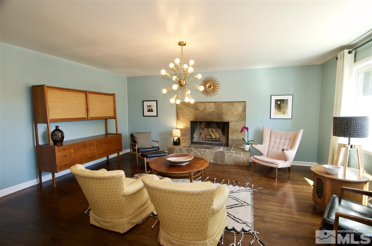 445 Ballentyne Way Reno, NV 89502 - Photo 6 of 25 a living room with furniture a fireplace and a flat screen tv