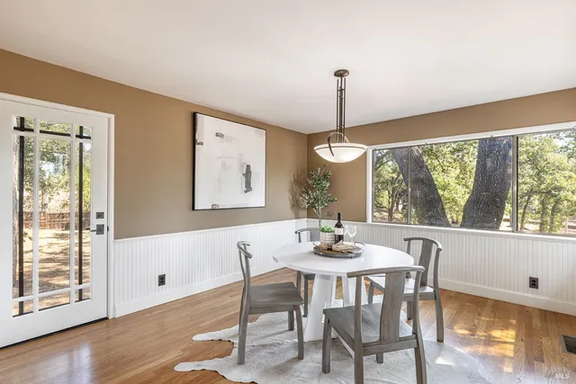 a bedroom with a bed and a table