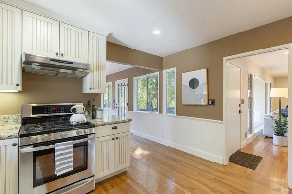 a view of a dining room with furniture window and outside view