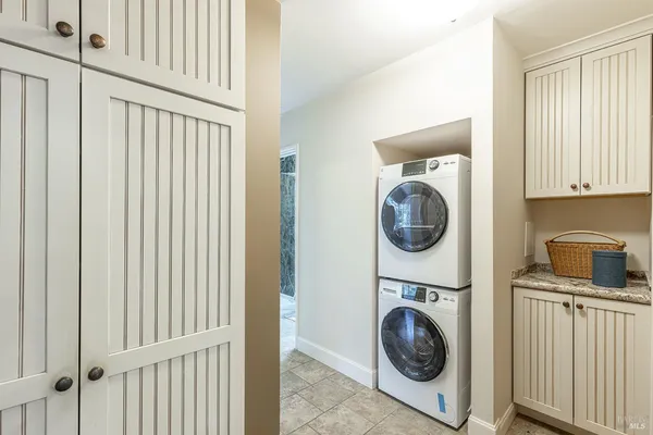 a view of dirt yard with a tree