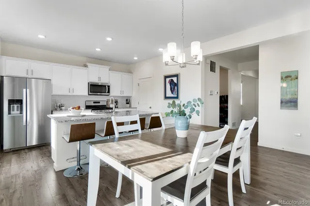 a living room with furniture a window and a fireplace
