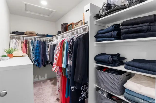 a spacious bathroom with a double vanity sink mirror and shower