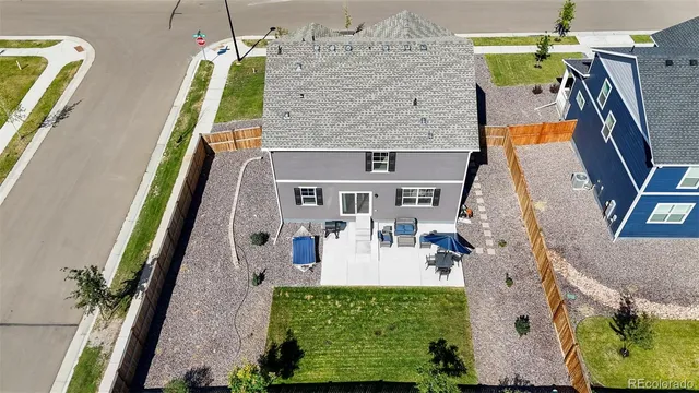 a aerial view of a house with a yard