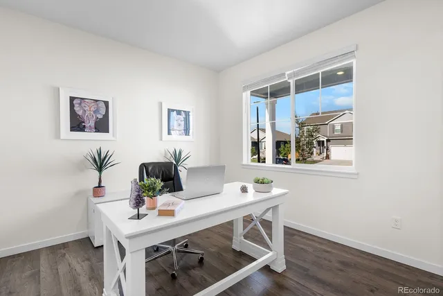 a view of a workspace with furniture