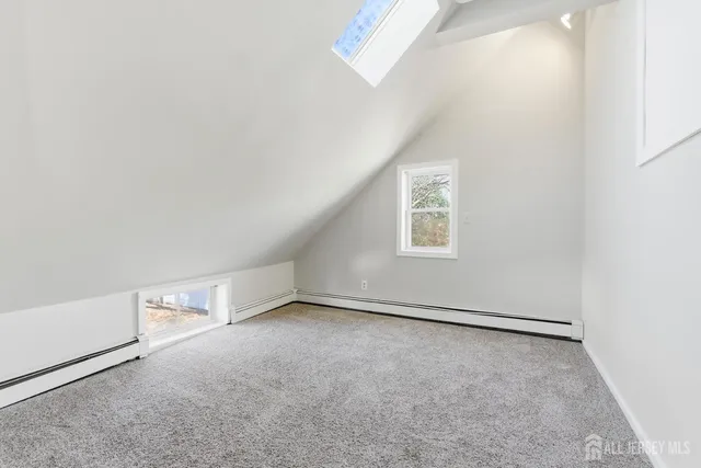 an empty room with a empty space and windows