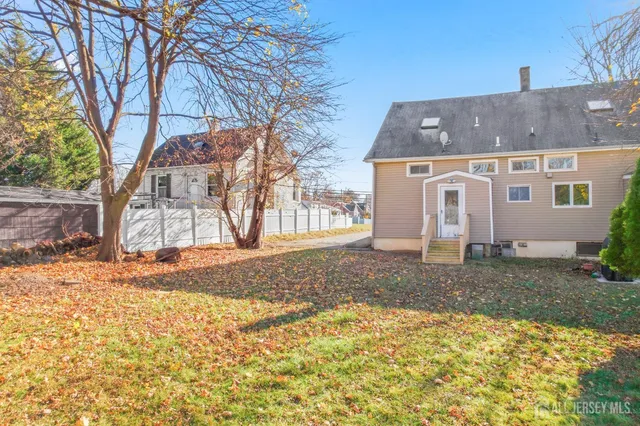 a view of a house with snow on the road