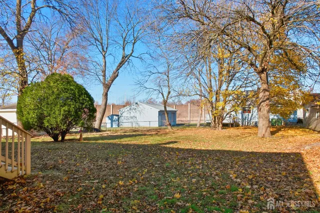a view of a yard with a tree