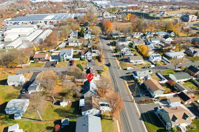 an aerial view of residential houses with outdoor space