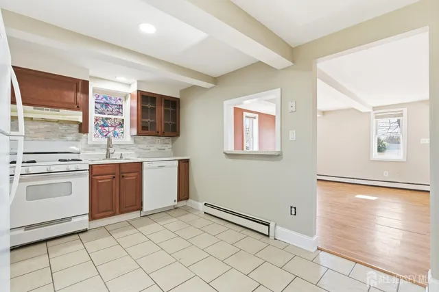 a kitchen with stainless steel appliances granite countertop a sink and cabinets