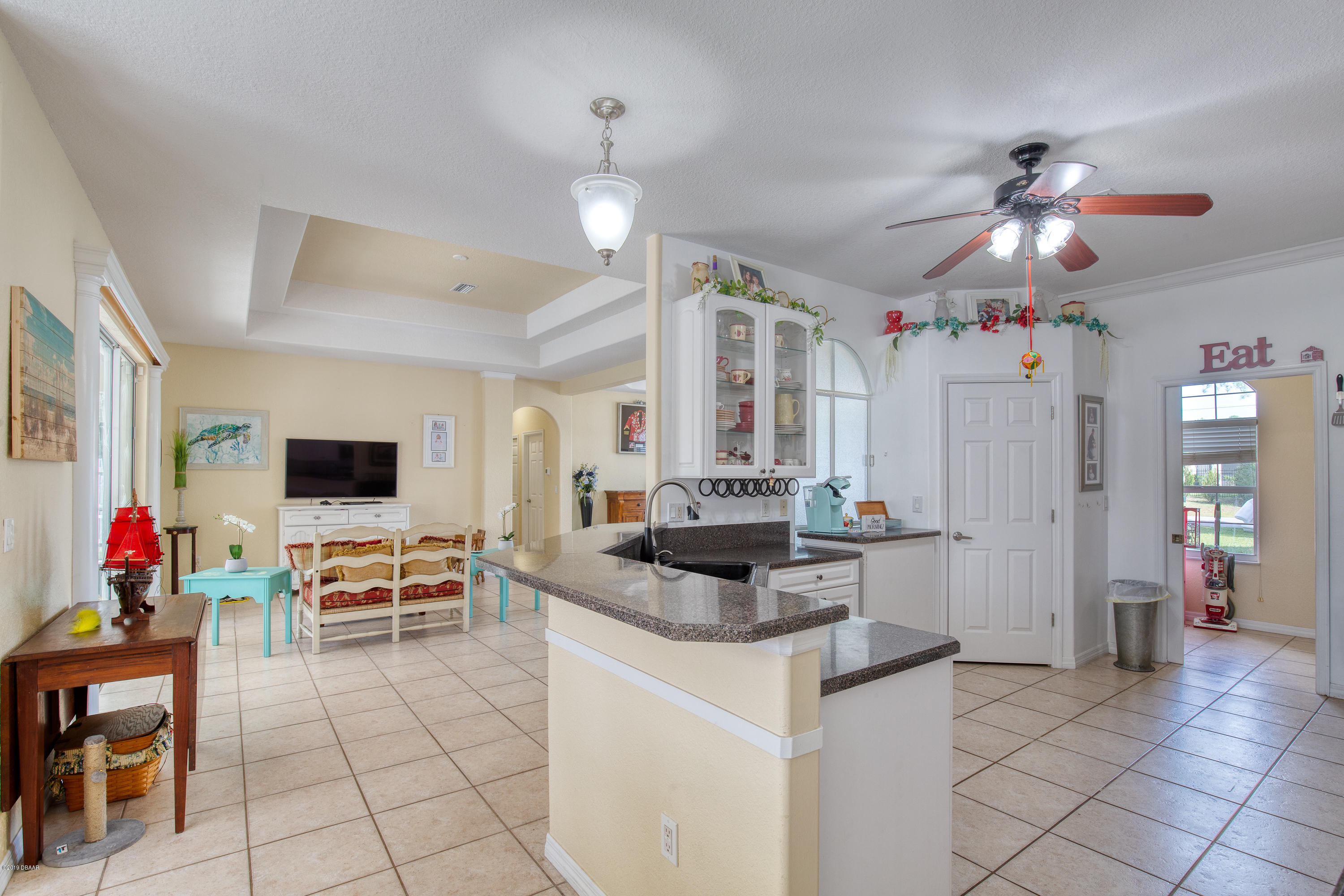 36 Pine Tree Drive Palm Coast, FL 32164 - Photo 12 of 52 a living room with furniture and flat screen tv