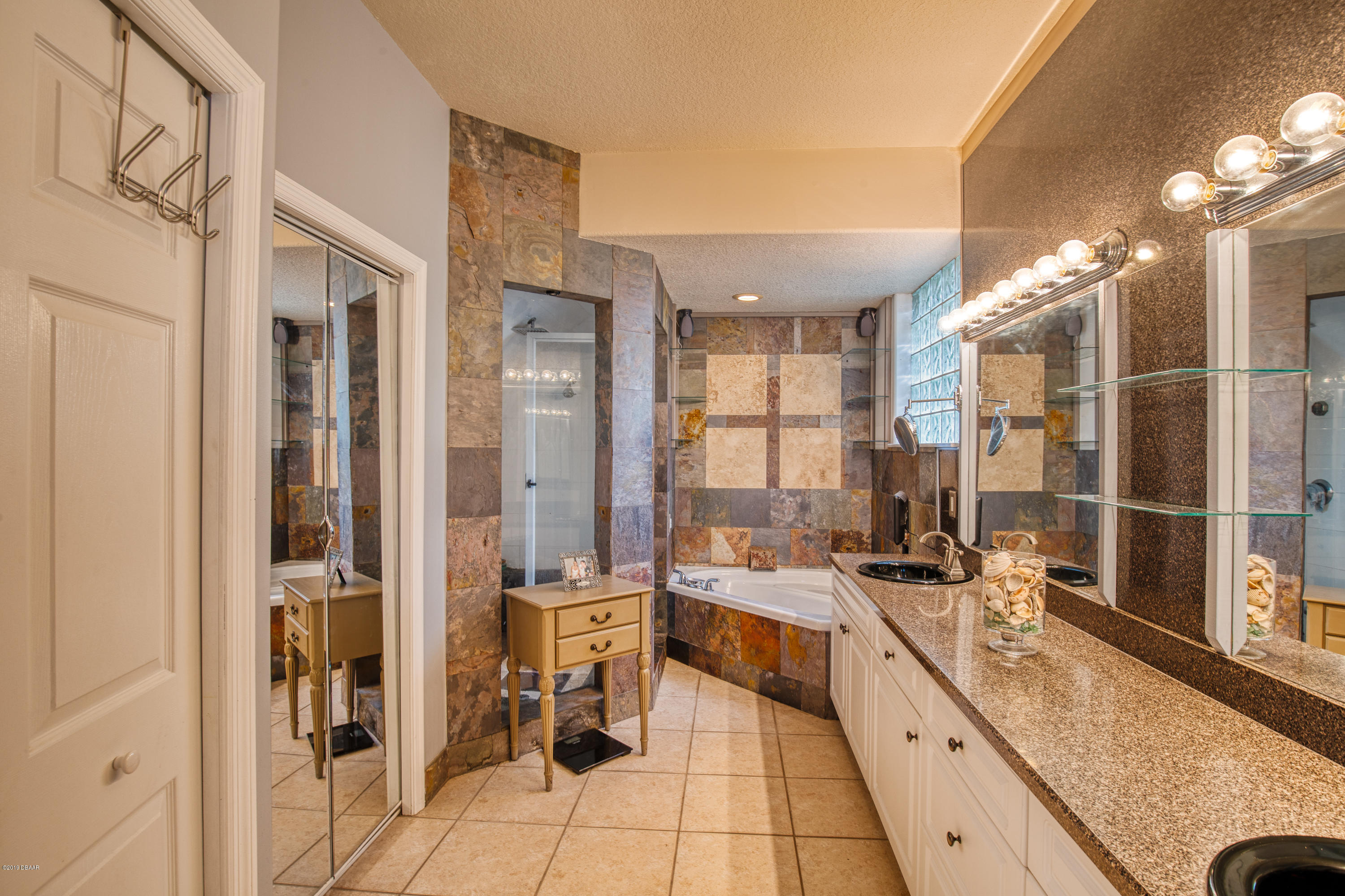 36 Pine Tree Drive Palm Coast, FL 32164 - Photo 17 of 52 a large white kitchen with sink and a large mirror