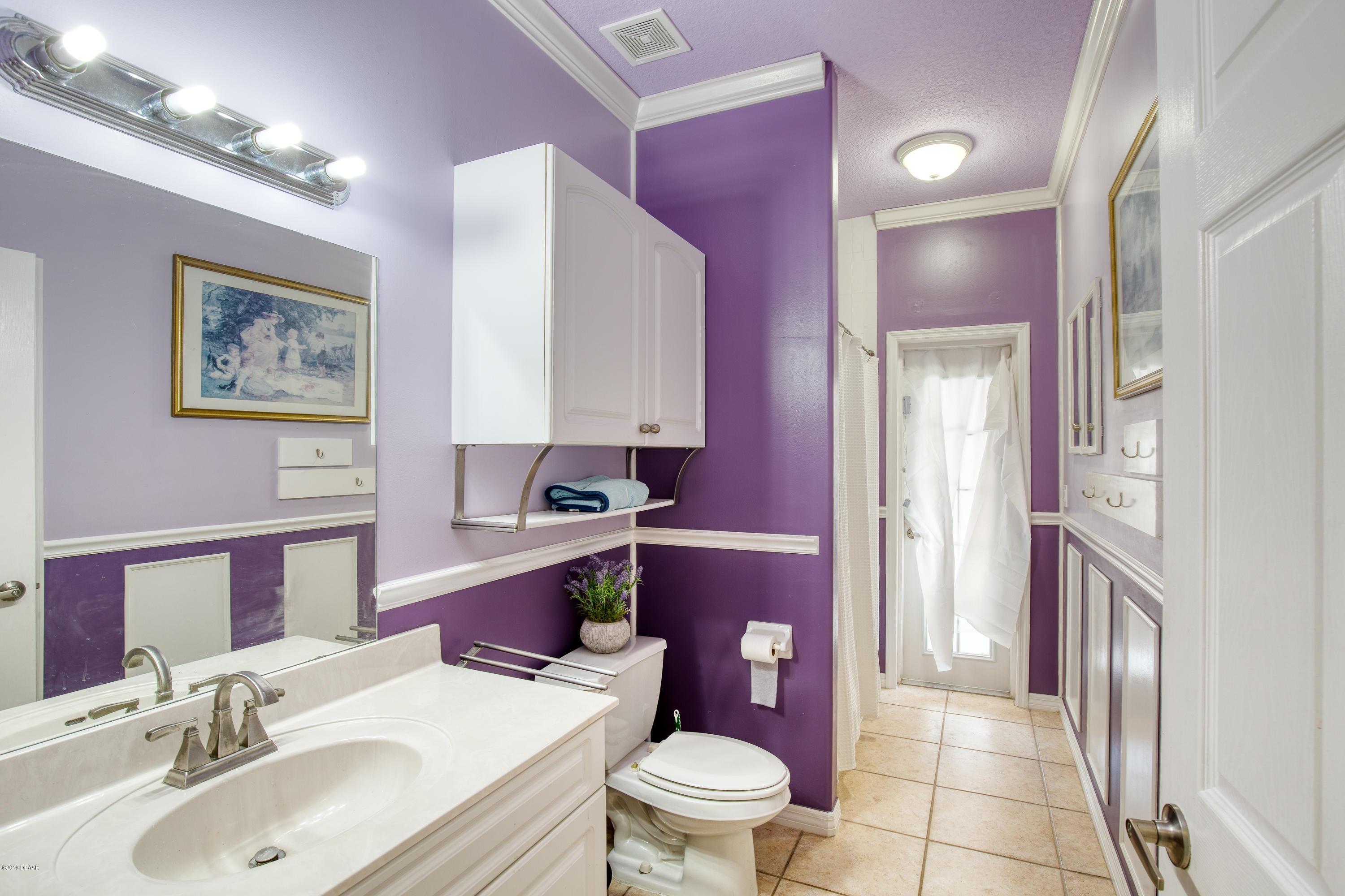 36 Pine Tree Drive Palm Coast, FL 32164 - Photo 25 of 52 a bathroom with a sink toilet and shower