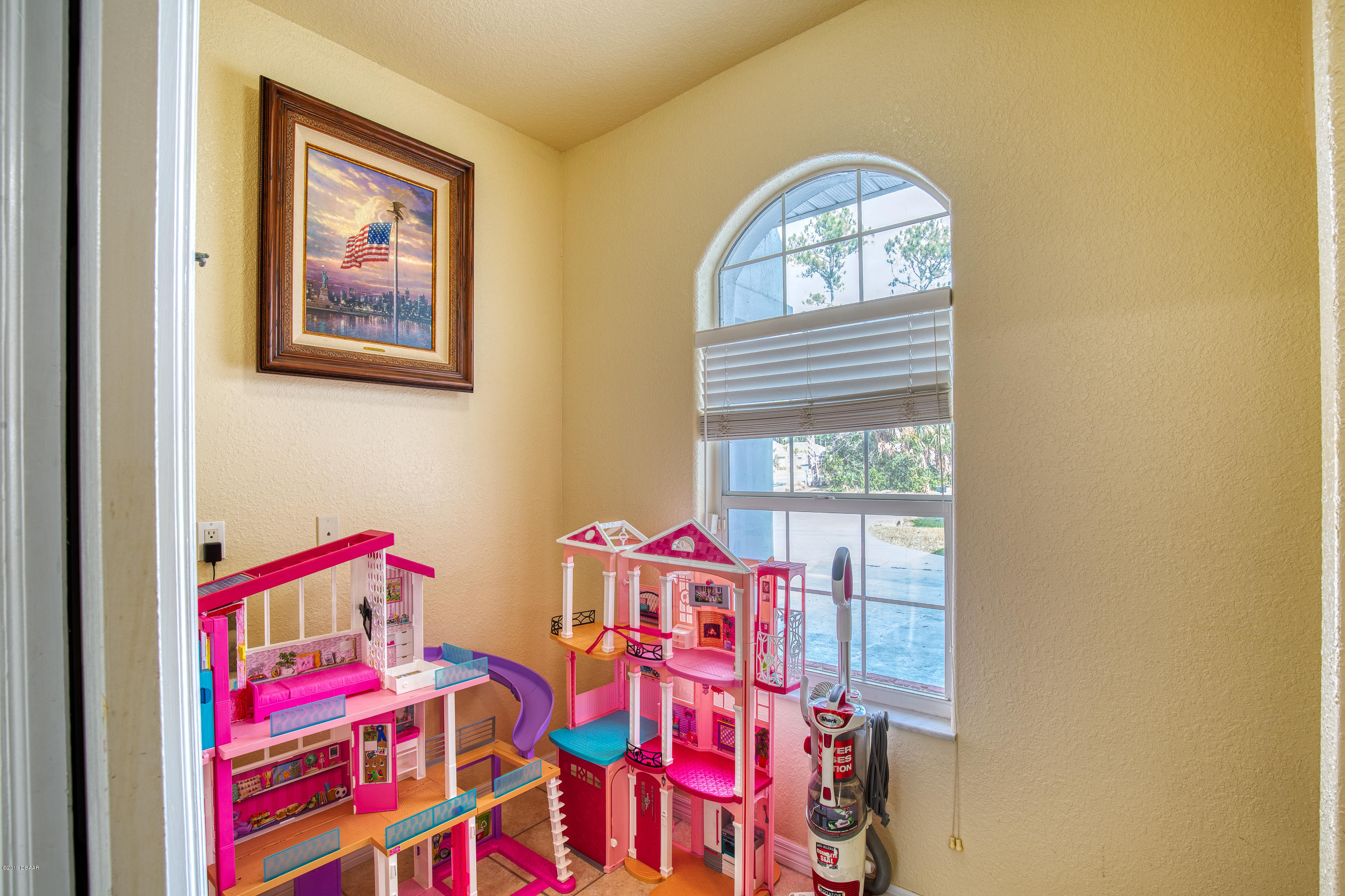 36 Pine Tree Drive Palm Coast, FL 32164 - Photo 31 of 52 a bedroom with a bed and a painting on the wall