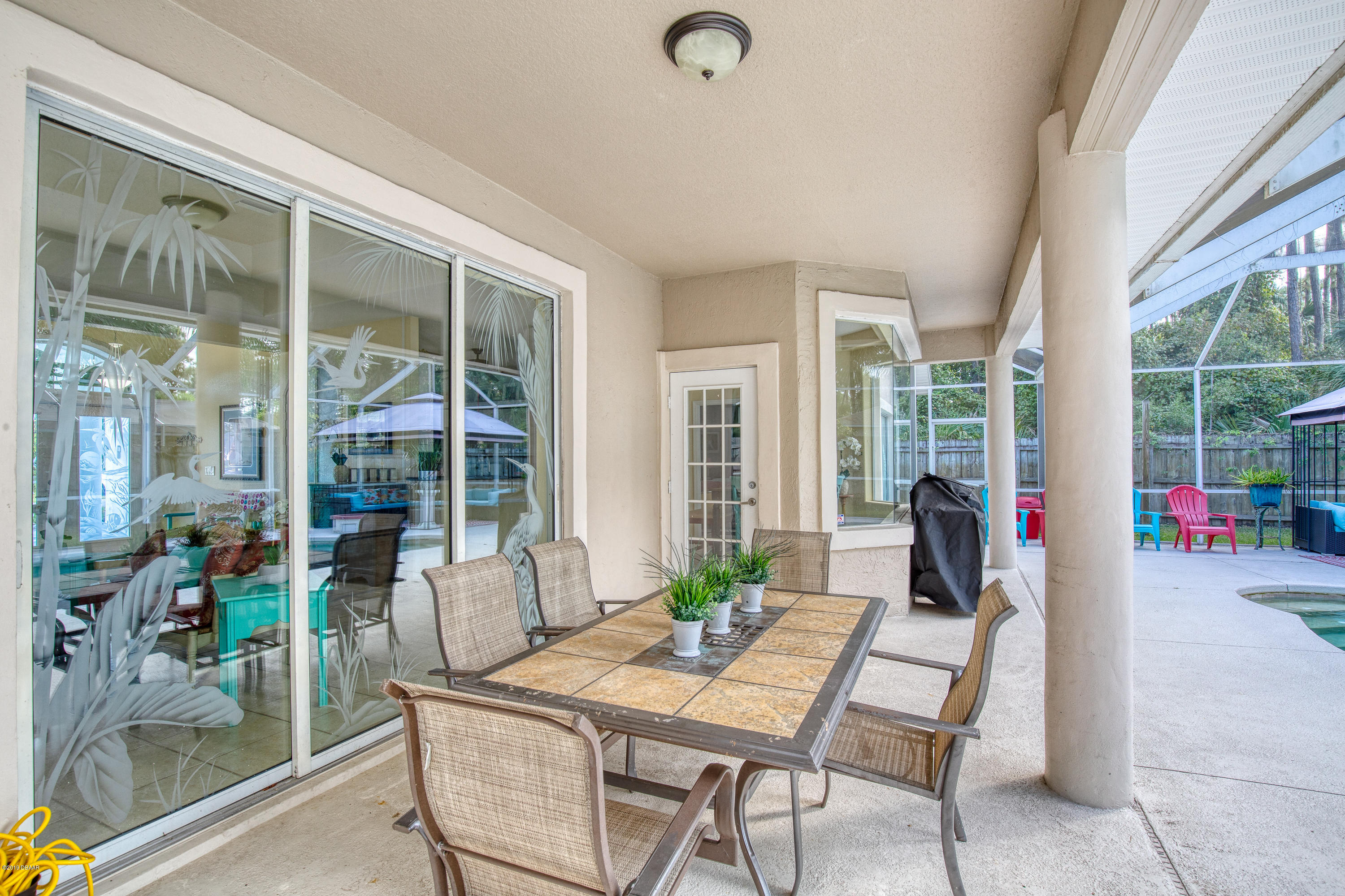36 Pine Tree Drive Palm Coast, FL 32164 - Photo 39 of 52 a view of a livingroom with furniture and floor to ceiling window