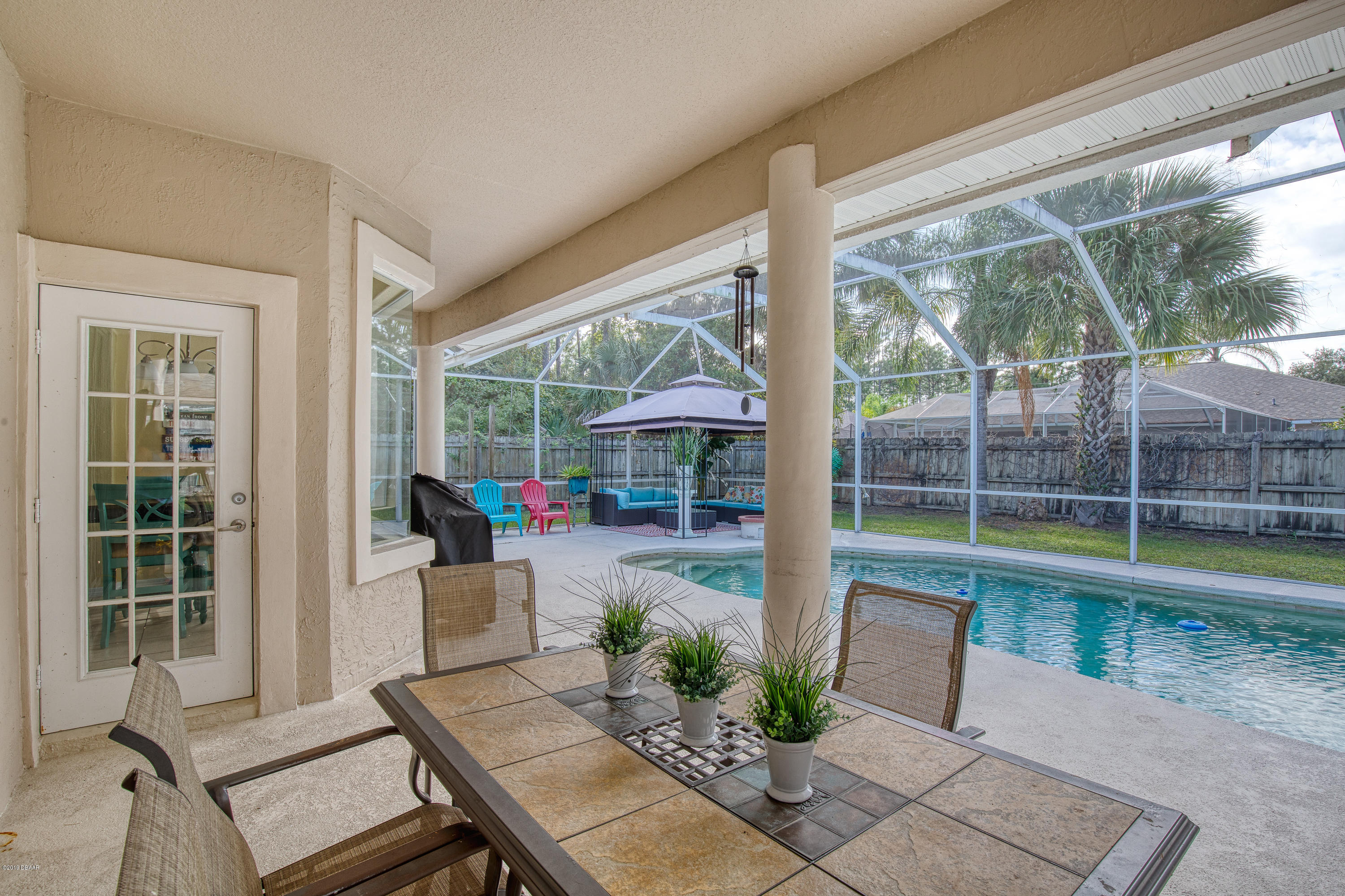 36 Pine Tree Drive Palm Coast, FL 32164 - Photo 40 of 52 a outdoor space with a table and chairs
