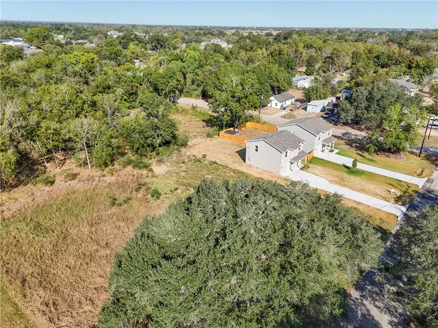 an aerial view of residential house with outdoor space