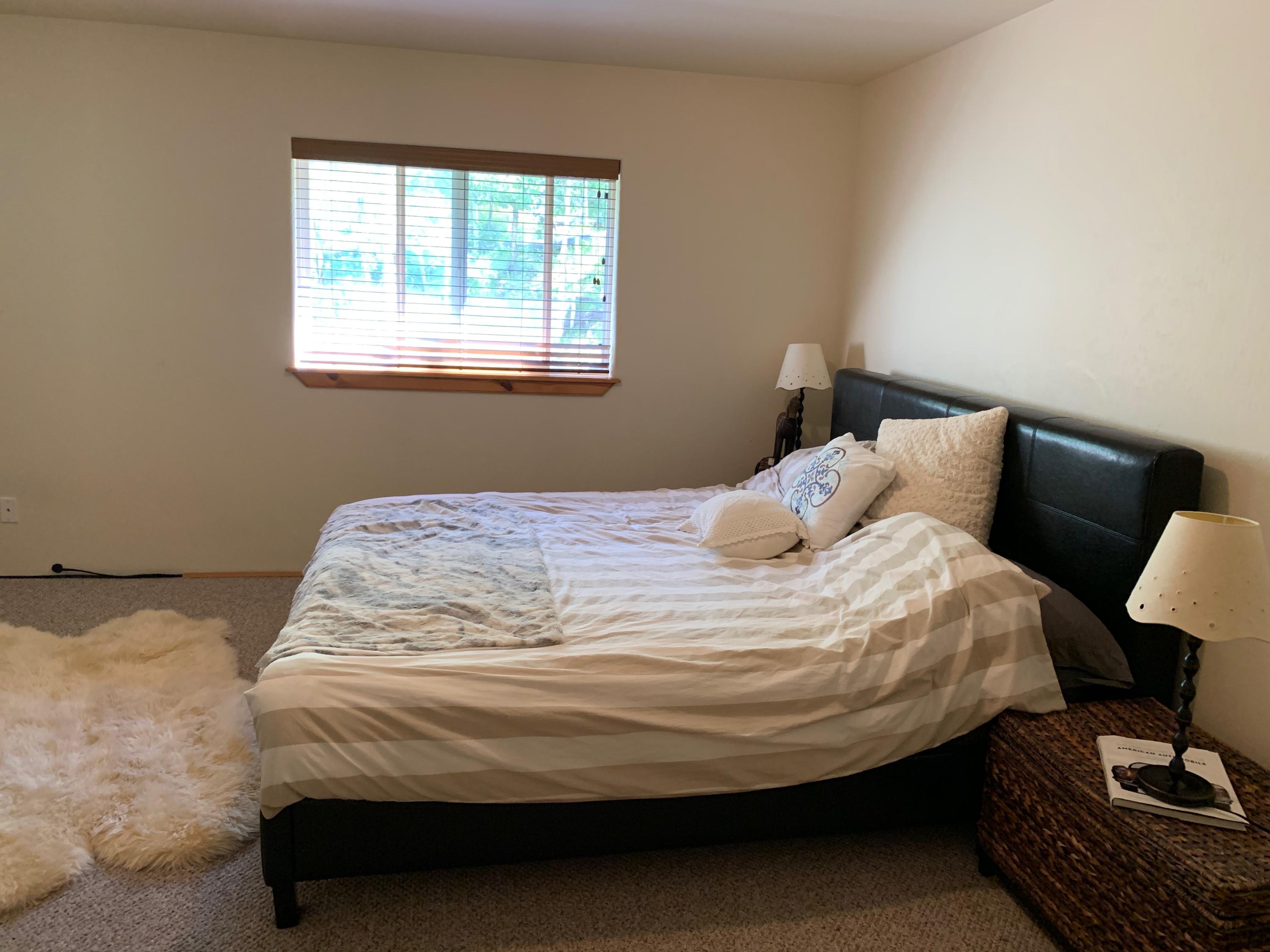 323 Adams Ranch Road, Unit 5B Mountain Village, CO 81435 - Photo 14 of 30 a bedroom with a bed and a window