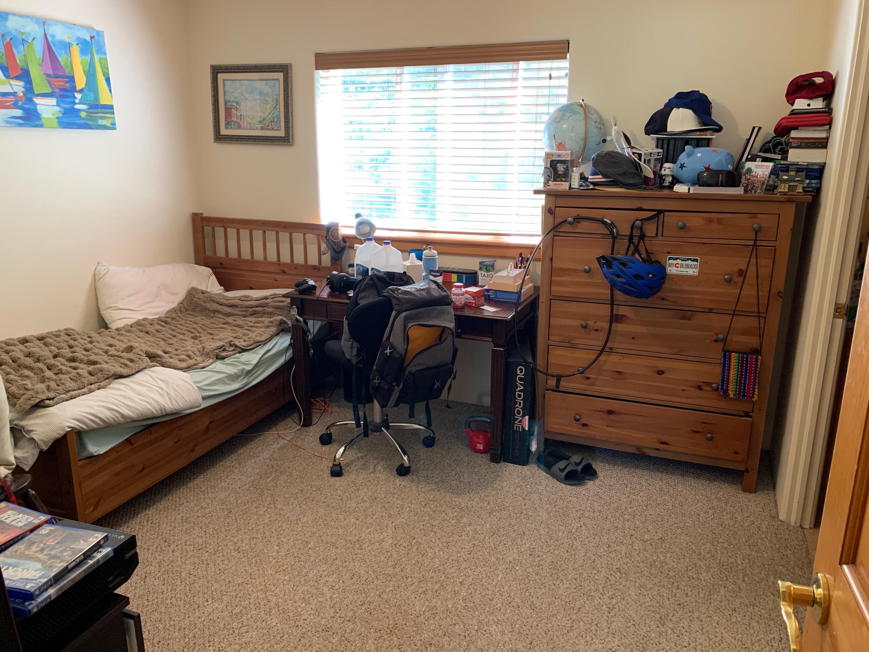 323 Adams Ranch Road, Unit 5B Mountain Village, CO 81435 - Photo 20 of 30 a bedroom with furniture and a window