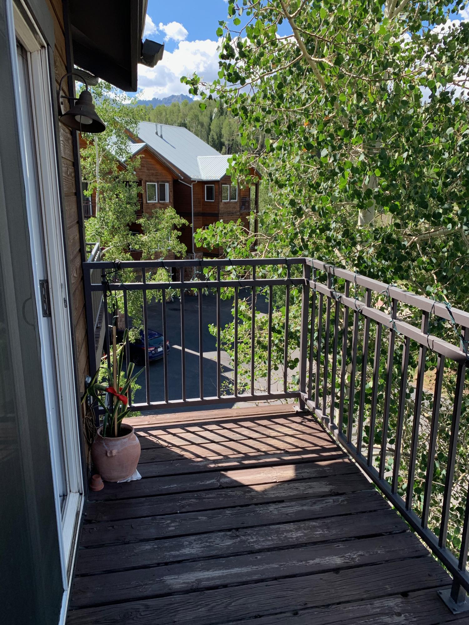 323 Adams Ranch Road, Unit 5B Mountain Village, CO 81435 - Photo 25 of 30 a view of a balcony with sitting area