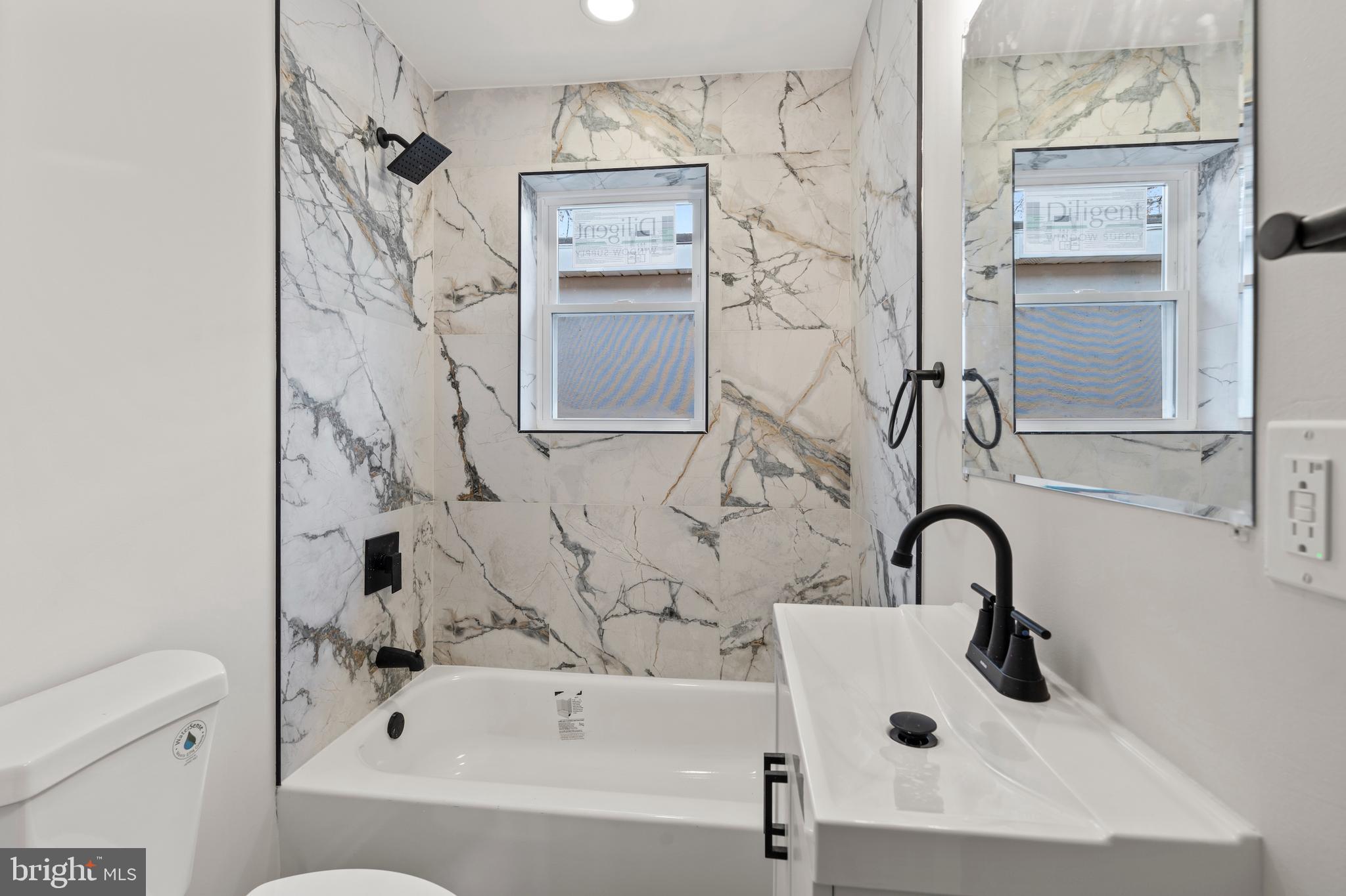 730 New Pittsburg Avenue, Unit 1 Baltimore, MD 21222 - Photo 16 of 27 a bathroom with a sink and a bathtub