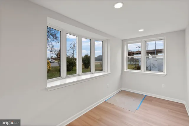 a view of an empty room with a window