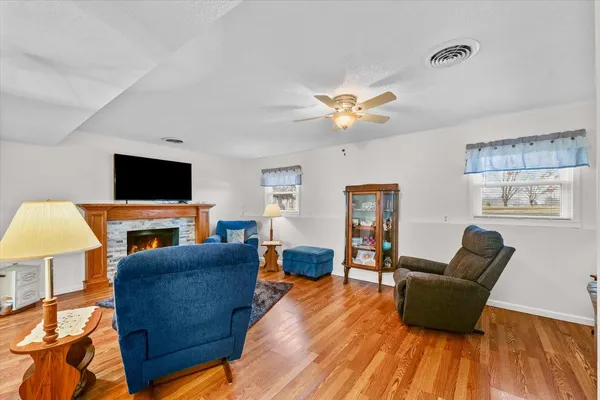 a living room with furniture and a flat screen tv