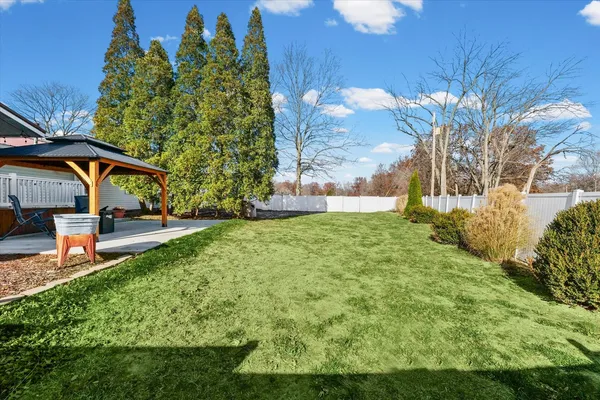 a view of a pathway of a house with a yard
