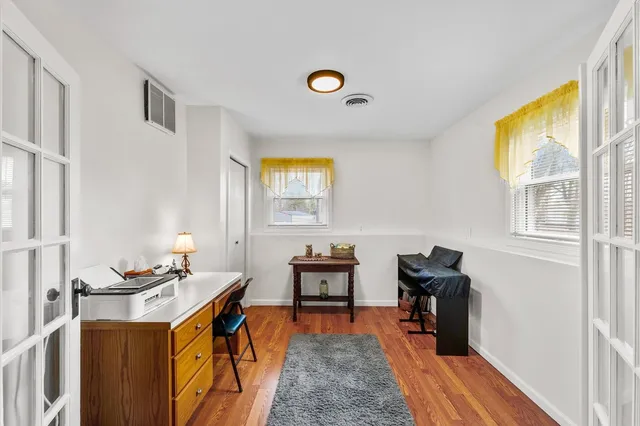 a room with furniture a rug and a window