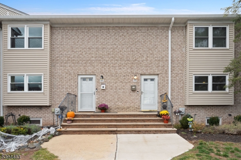 a front view of a house with many windows