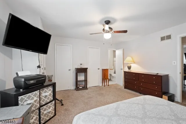 a bedroom with bed and a window