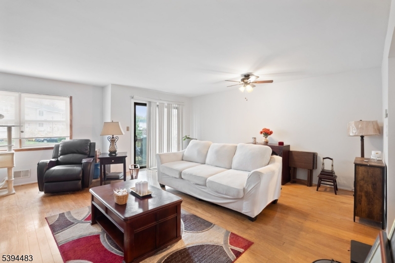 919 Robin Road Hillsborough, NJ 08844 - Photo 15 of 21 a living room with furniture ceiling fan and a window