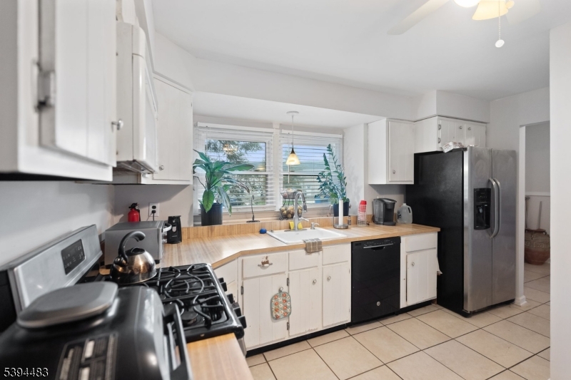 919 Robin Road Hillsborough, NJ 08844 - Photo 16 of 21 a kitchen that has a lot of cabinets and refrigerator