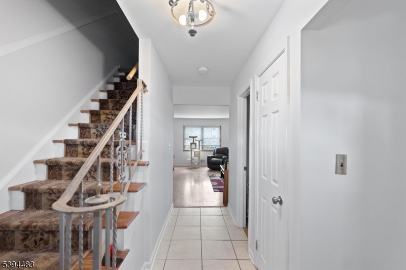 919 Robin Road Hillsborough, NJ 08844 - Photo 20 of 21 a view of a hallway with wooden floor and entryway